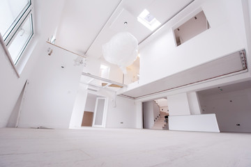 Interior of empty stylish modern open space two level apartment