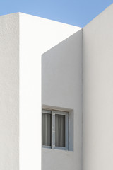 Minimal background in architectural style. White walls against the blue sky.