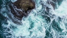 Rough Sea Waves Crashing On The Rock In The Emerald Sea.Aerial Vertical Background