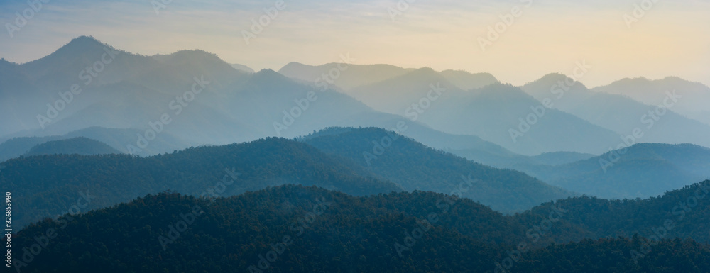 Amazing wild nature view of layer of mountain forest landscape