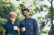© chokniti - Old father and son, Morning coffee in a garden