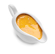 Gravy boat of tasty honey mustard sauce on white background