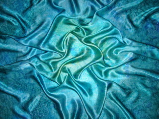 Blue silk fabric with drapery. The texture of the fabric. Natural silk. Blue silk scarf, silk scarf.