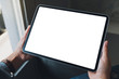 © Farknot Architect - Mockup image of a woman holding black tablet pc with blank white screen in cafe