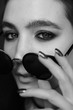 © Oleg Samoylov - Black-white close-up portrait of a beautiful young girl in black round sunglasses.Girl poses for the photographer.Fashion portrait