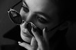 © Oleg Samoylov - Black-white close-up portrait of a beautiful young girl in black round sunglasses.Girl poses for the photographer.Fashion portrait