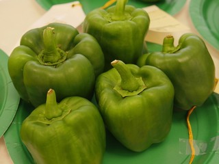 Close up of green bell peppers at an agricultural exhibit