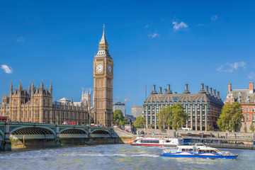 Fototapete - Big Ben and Houses of Parliament with boats on the river in London, England, UK