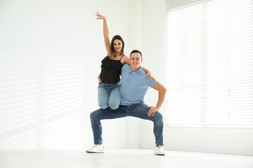 Sticker - Happy young couple dancing in empty studio