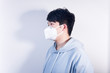 © Steve - A man wearing a N95 medical protective mask