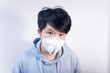 © Steve - A man wearing a N95 medical protective mask