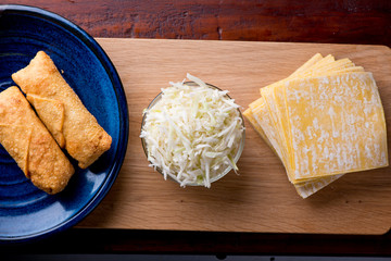 Eggrolls or Springrolls. Traditional Chinese, Thai or Japanese restaurant appetizer, fried. Made from wonton wrappers & filled with Chinese veggies and served w/ a chili dipping sauce or soy sauce.  