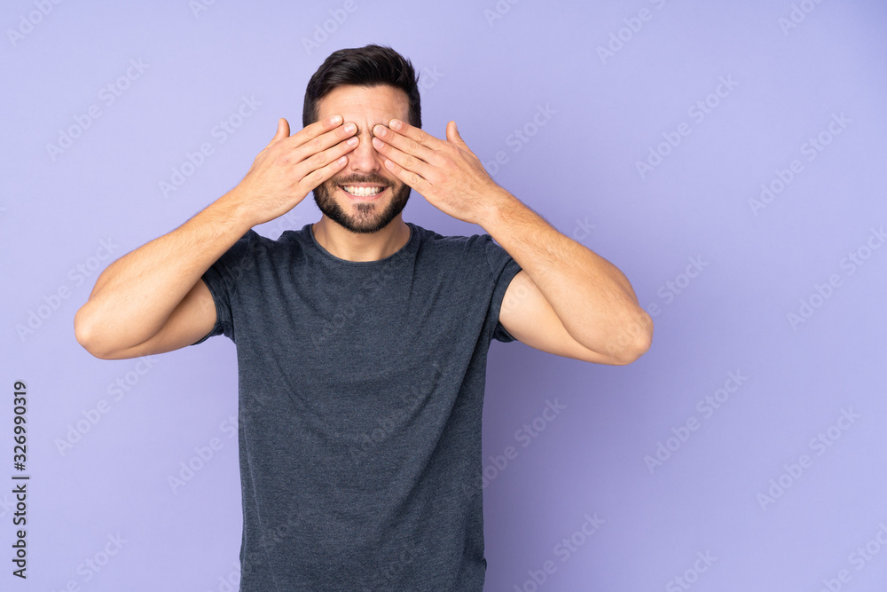 Caucasian handsome man covering eyes by hands and smiling over isolated ...