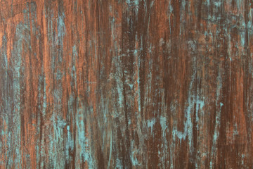 The texture of the copper background is covered with a patina