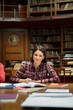 © Rido - Portrait of happy smiling student at library