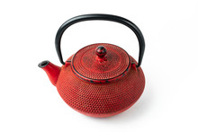 Red Cast Iron Teapot On A White Background. Asian Culture.