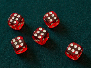 red dices on green cloth casino gambling luck