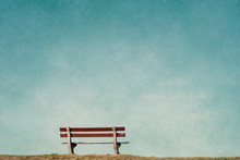 Empty Bench In An Empty Blue Background