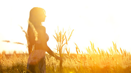 Poster - Attractive yong woman with the bouquet. Rural background.