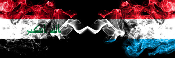 Iraq, Iraqi vs Luxembourg smoky mystic flags placed side by side. Thick colored silky smokes flags together.