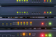 © Климов Максим - Devices for voice ip Internet connection are in racks. Technology concept. Network telephone routers are close-ups. Telecommunication equipment works in the server room of the data center.