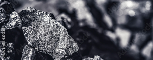 Fotomural Coal miner in the man hands of coal background. Coal mining