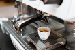 © pariwatpannium - black coffee in white cup on coffee maker