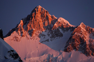 The first ray of the sun touches Mt. Kanchanjunga, the thirds highest peak in the world 8,586 meters as seen from Dzongri top in West Sikkim. Local people take Mt. Kanchanjunga as guardian deity and p