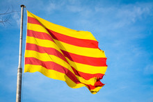 Catalonia Flag With Blue Sky Background.