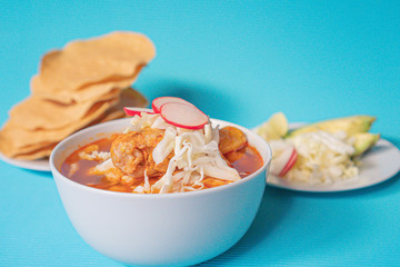 Wall Mural - Delicious typical Mexican red Mexican pozole with tostadas