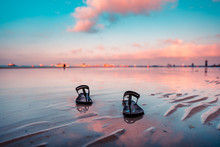 A Pair Of Slippers Left At The Shore Of Boracay For An Early Morning Walk