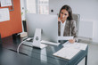 © Yakobchuk Olena - Serious businesswoman is sitting at her workplace