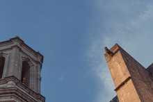 Detail Of High Tower In Gothic Heritage Landmark Girona's Cathedral In Catalonia On A Sunset Blue Sky
