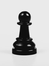 Single Shiny Black Chess Pawn Isolated, Matte, Low Contrast. One Lonely Chess Piece On Grey Background, Macro, Closeup Abstract. Game Of Chess Universal Symbol
