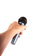 © Tomasz - A hand holding out a simple wireless microphone away from the viewer isolated on white Giving voice to someone, speaking up, public speech, passing the mic to the speaker, singing reaching out concept