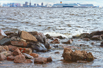 gulf coast in St. Petersburg, Russia, opposite the seaport and residential buildings