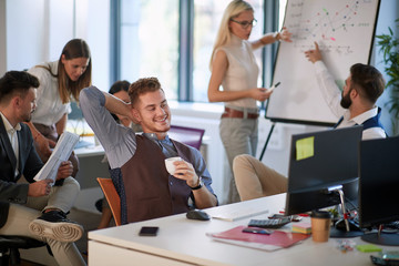 Wall Mural - Coffee break at startup modern company.  Businessman enjoying at coffee.