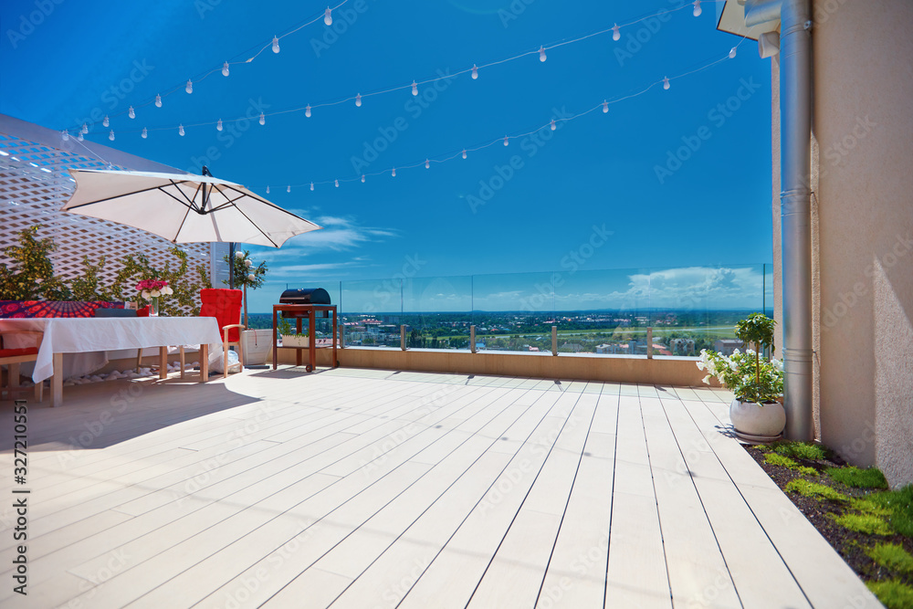 furnished patio zone, rooftop terrace at warm summer day - obrazy, fototapety, plakaty 