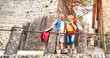 Leinwanddruck Bild - Senior retired couple having genuine fun in San Marino old town castle - Active elderly and travel lifestyle concept with mature people at italian roadtrip - Warm bright filter with soft sunshine halo