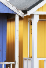 Abstract View Of Beach Huts. Sutton On Sea Beach Hut Juxtaposition Of Colours And Structure Of Huts. Various Colours In Vivid Shades And Brightness. Summertime Holiday Resort.