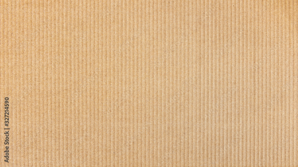 Paper cardboard background. Natural corrugated carton sheet. Kraft cardboard texture with vertical stripes. - obrazy, fototapety, plakaty 