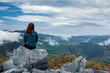 woman on top of mountain gazing into the future