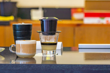 Vietnamese dripping coffee served with condensed milk- ca phe sua