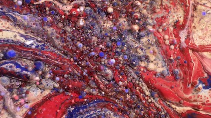 Wall Mural - Colorful acrylic paints mix in beautiful patterns. Oil Inks of coral, orange, red and other colors spread over the surface and mix, creating amazing textures and design. Abstract bubbles