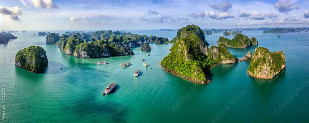 Aerial view Vung Vieng floating fishing village and rock island, Halong Bay, Vietnam, Southeast Asia. UNESCO World Heritage Site. Junk boat cruise to Ha Long Bay. Famous destination of Vietnam - obrazy, fototapety, plakaty 