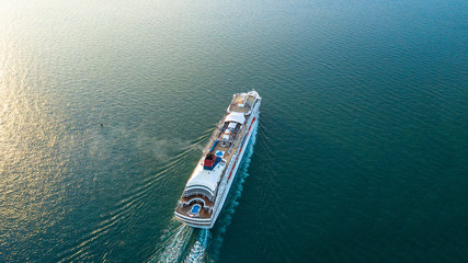 Wall Mural - Aerial view Cruise ship at sunset in ocean, Aerial view large cruise ship at sea, Passenger cruise ship vessel, sailing across the Gulf of Thailand.