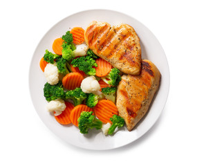 Wall Mural - plate of grilled chicken with vegetables on white background