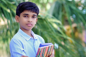 Wall Mural - Portrait of Indian little school boy posing to camera