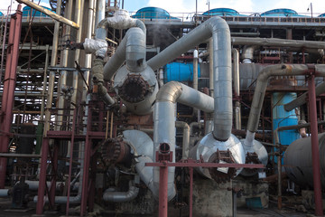 Trunk pipelines, reaction tanks. Chemical plant for the production of chemical fertilizers, nitric acid, ammonia. Day view.