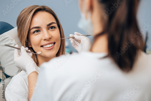Fotografía Professional doctor dentist examine and treat spoiled teeth with the use of special dental instruments, medical equipments